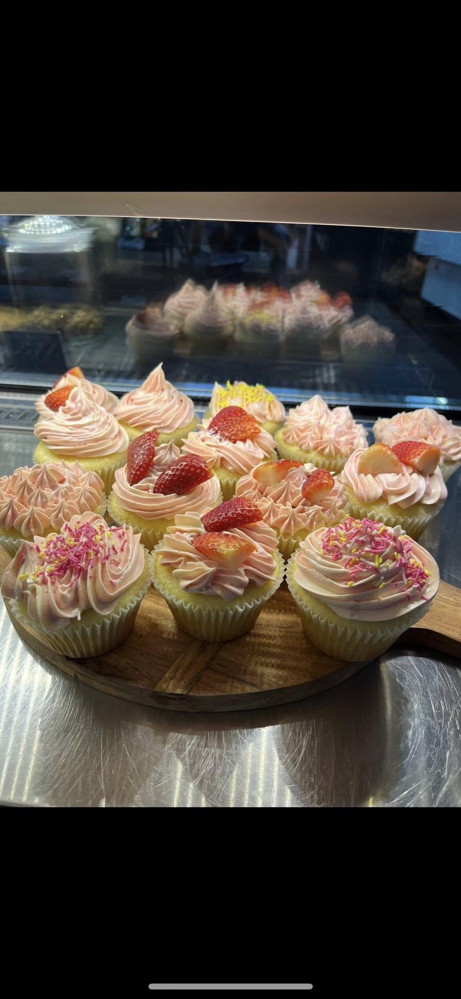 Interior of Mount Perry General Store cafe with flowers on the tables.